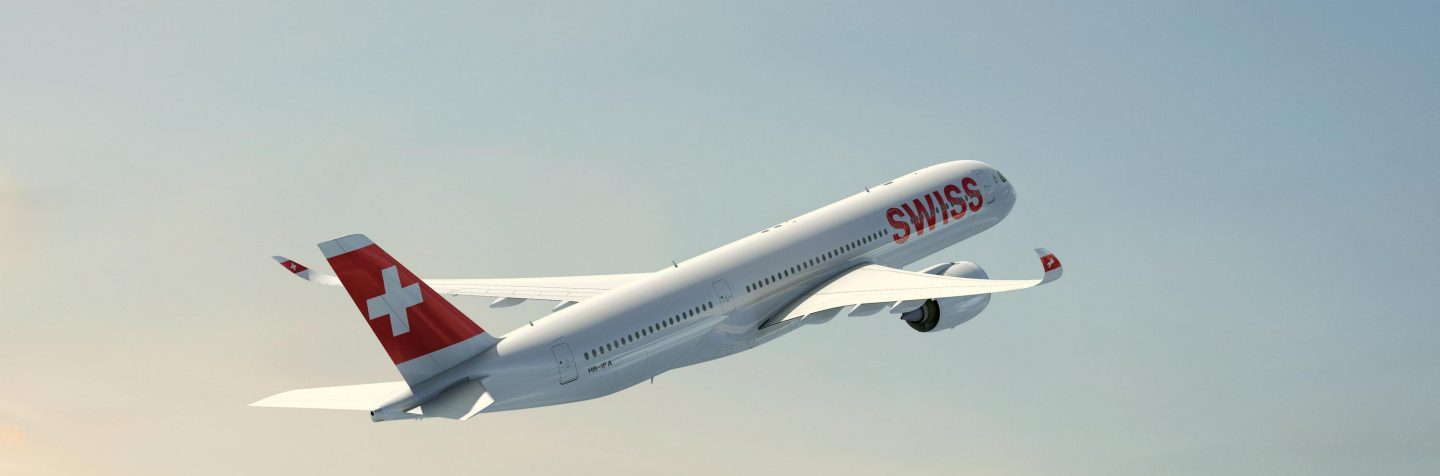 SWISS Airbus A350-900 aircraft flying in the sky.