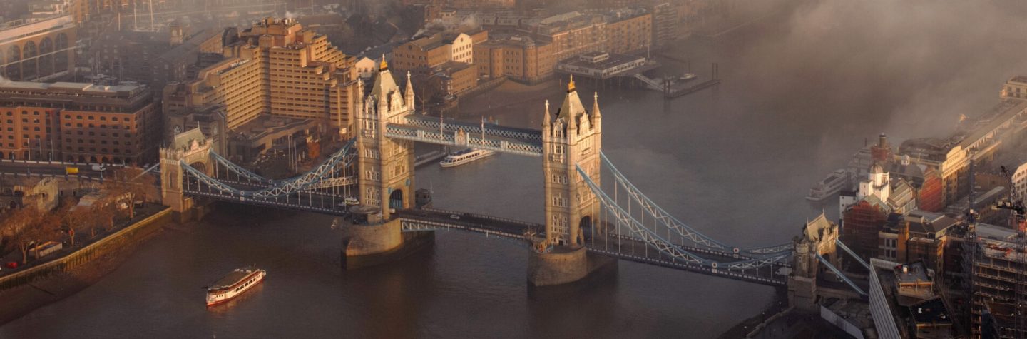 Aerial view of Tower Bridge and the Thames in London in fog.