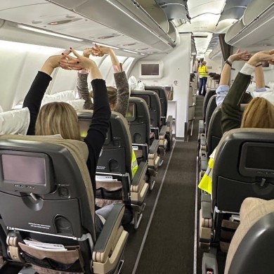 Participants practise simple breathing and relaxation techniques designed to reduce stress and build confidence when flying.