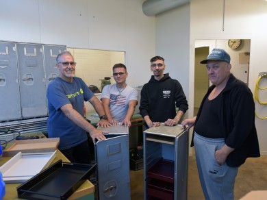 Remi, Prim, Francesco and Iwan from Züriwerk with two trolleys.
