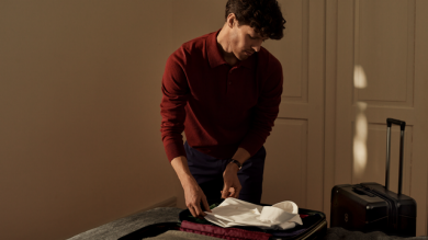 Man packing luggage.